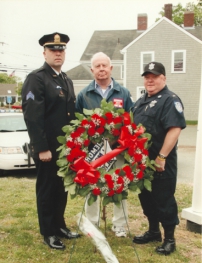 Left to right: Paul Bradley, a sergeant with the Pawtucket Police Dept., and a great-great-nephew of Officer Pierce, great-nephew Frank Seaman of Hyannis, and great-great-nephew Walter Benjamin, a lieutenant with MA Dept. of Correction.